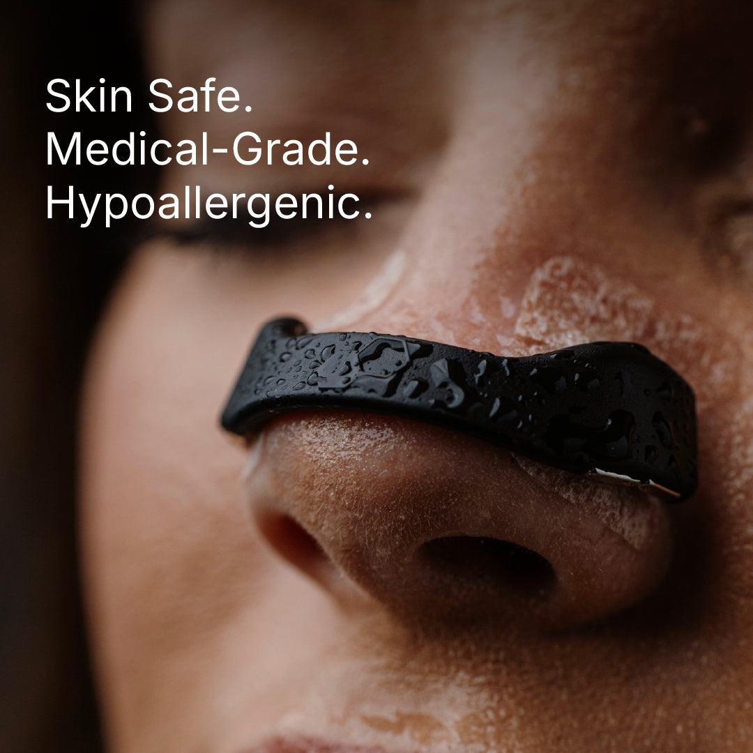 Black band on a person's nose with text 'Skin Safe. Medical-Grade. Hypoallergenic.'