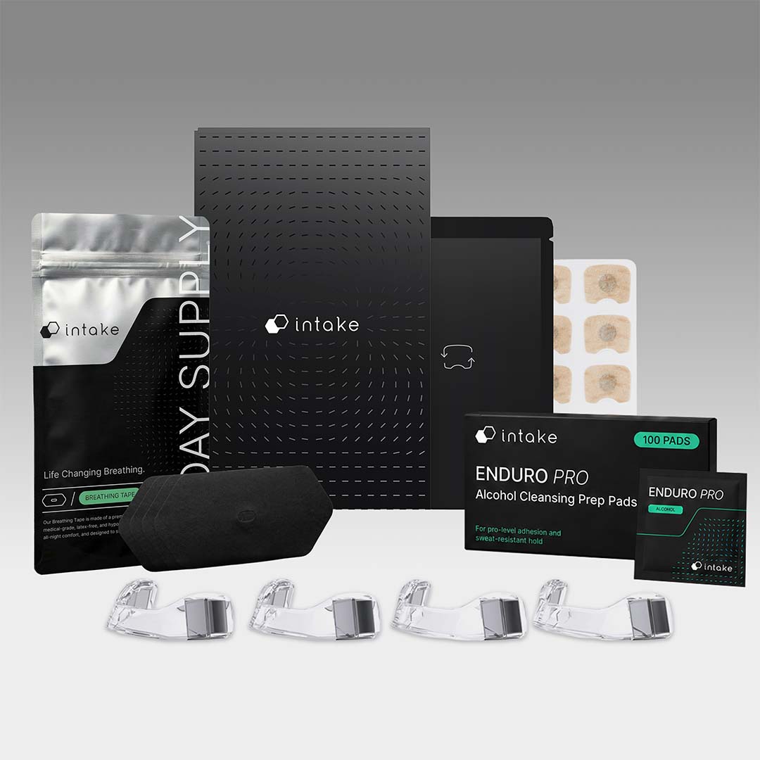 Collection of Intake products including packaging and hardware on a gray background